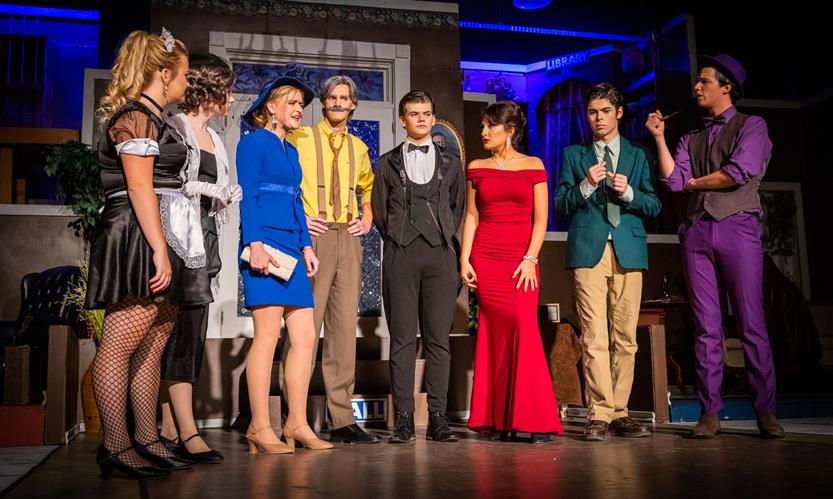 Students perform Clue onstage